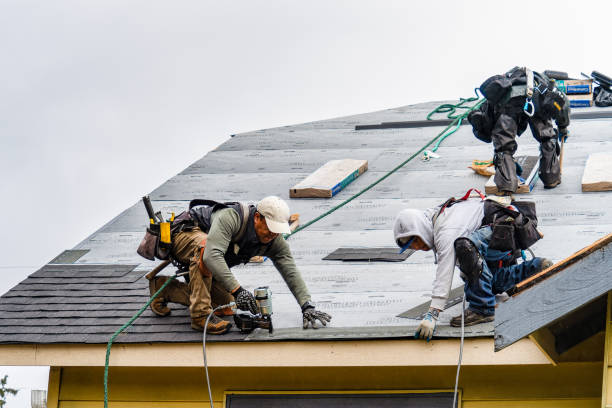 Professional Roofing technician working in Fowlerville, MI